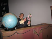 Nero Wolfe inspecting the orchids