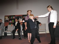 Joe Herrick blocking Iris Innes as Wolfe tests his theory