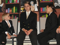 The photographers Herrick and Pizzi looking accusingly at Henry Frimm after Wolfe announces he is the murderer